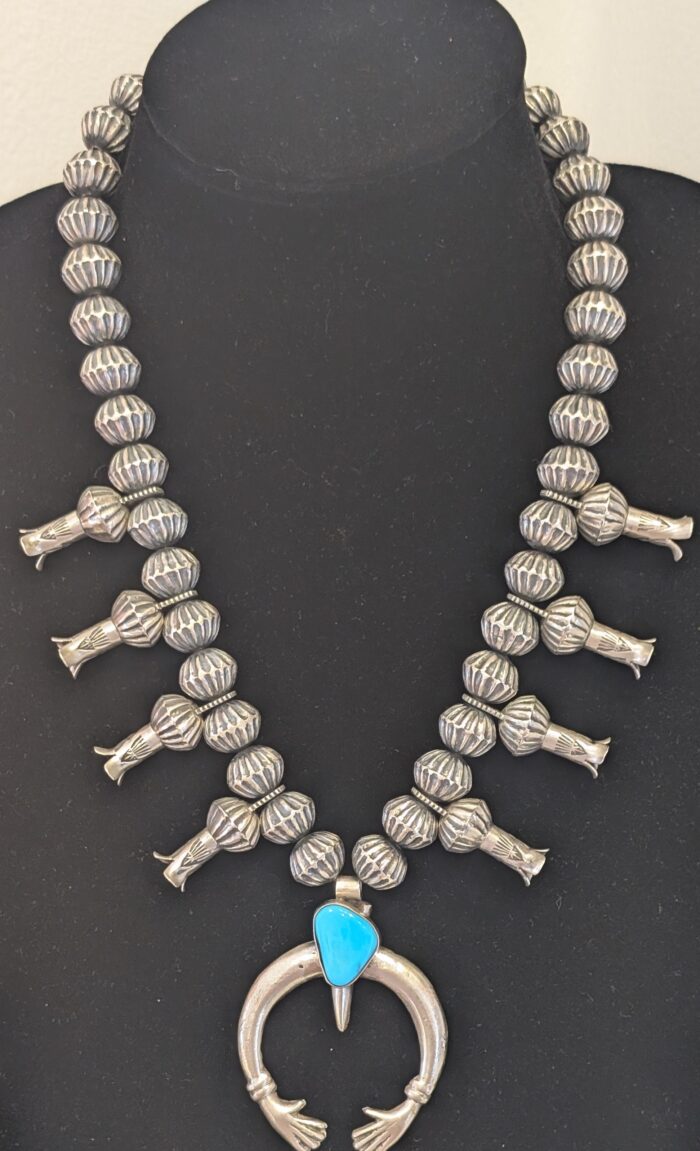 "Reaching Hands Squash Blossom Necklace" by Eugene Hall